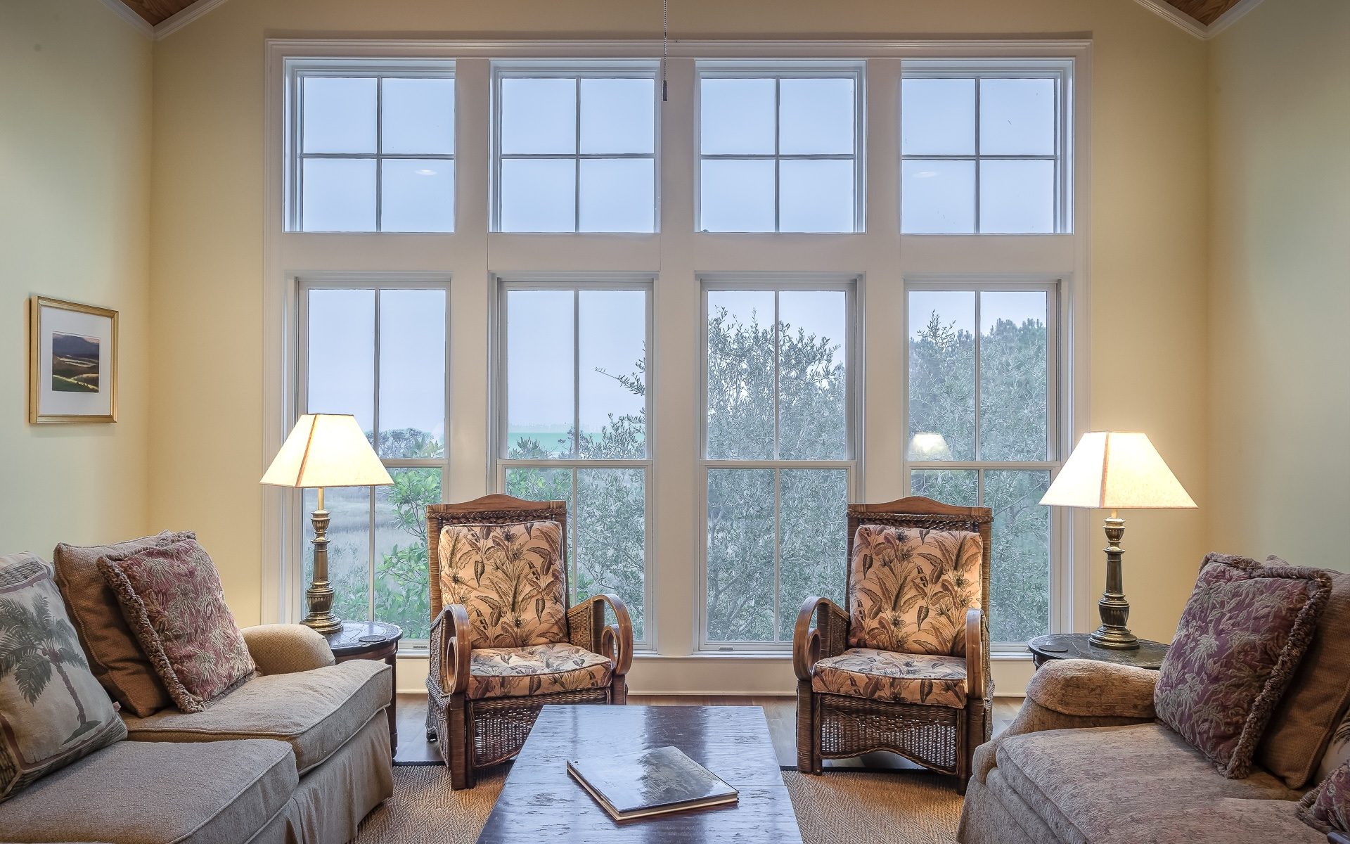 Cozy living room with large fiberglass windows.