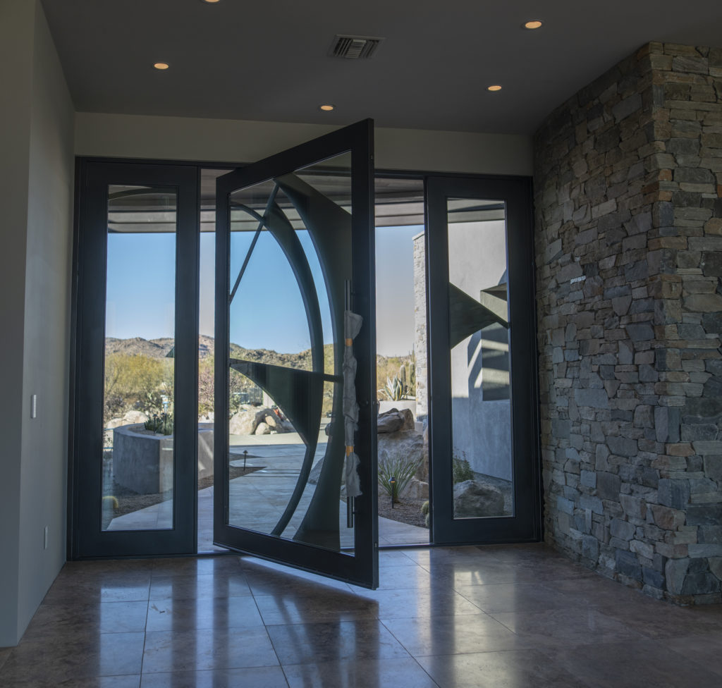 glass entrance doors to Madera Canyon home