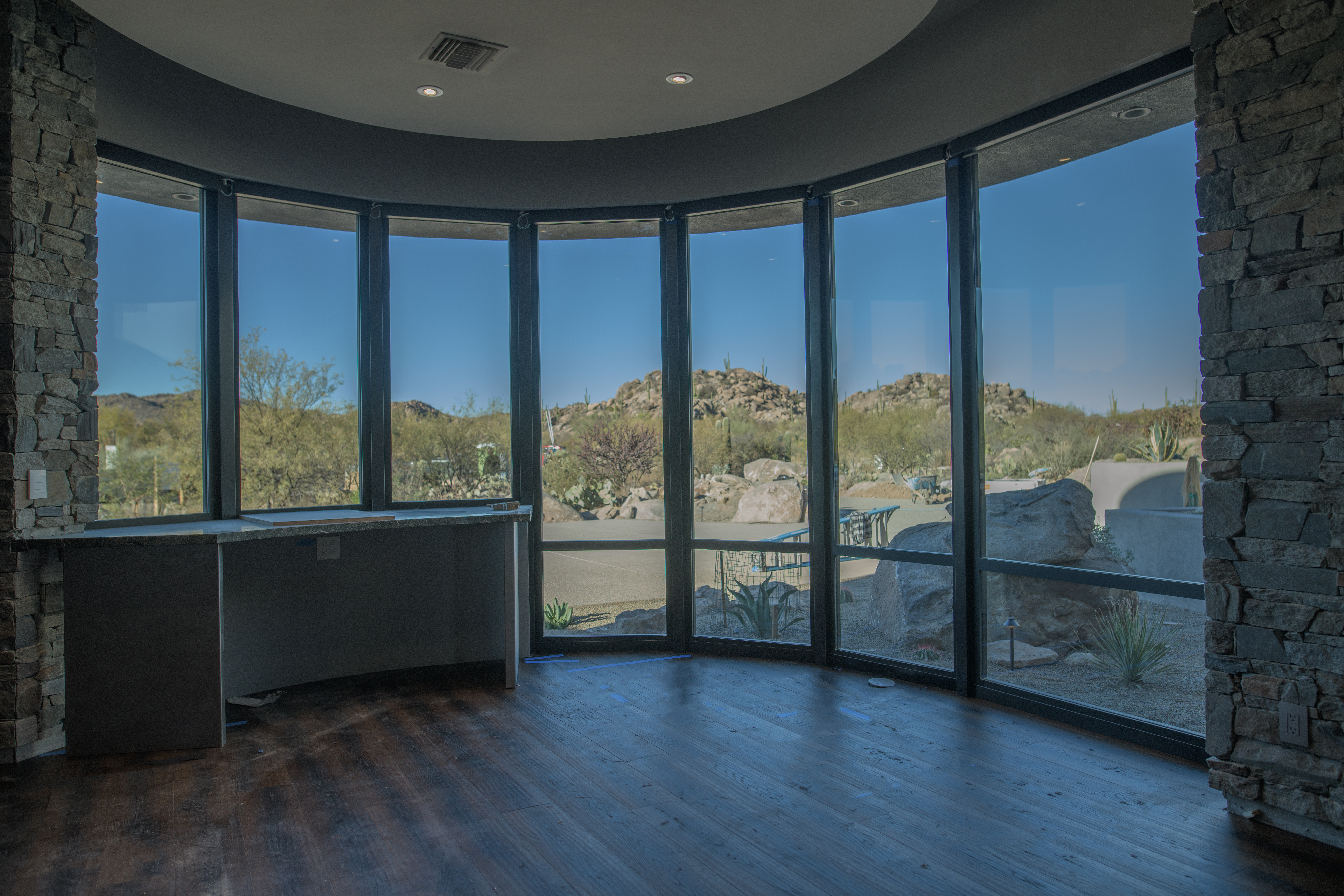 floor to ceiling windows in living room of Oro Valley home