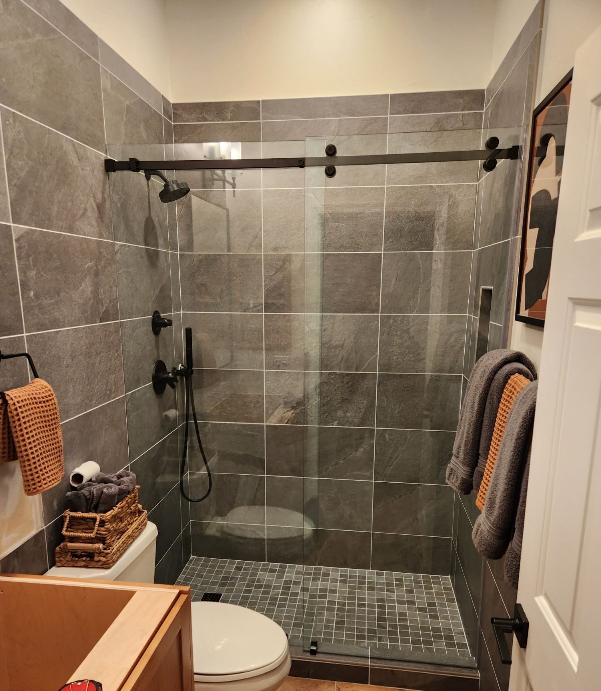 Open Enclose shower door installation in upgraded bathroom
